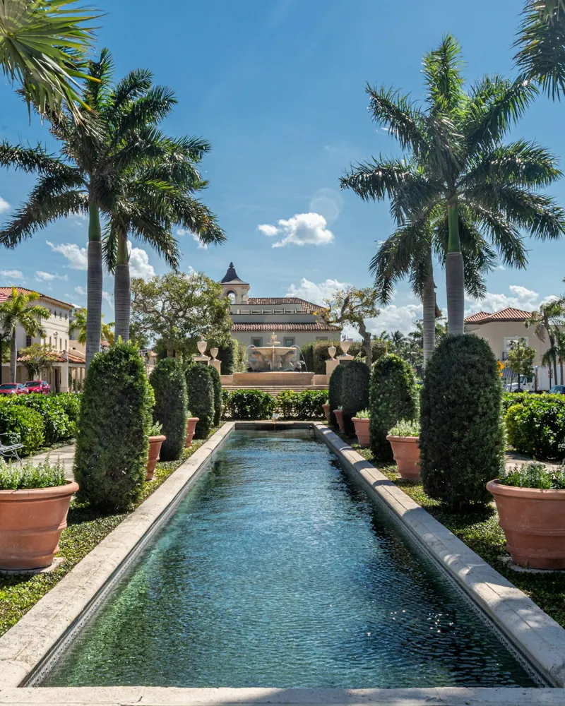 Palm trees and the courtyard fountain at Palm Beach Town Hall
